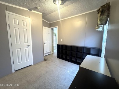 Welcome to your new home! This corner lot manufactured home in on Lake Tansi Village Country Club in Tennessee - for sale on GolfHomes.com, golf home, golf lot
