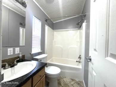 Welcome to your new home! This corner lot manufactured home in on Lake Tansi Village Country Club in Tennessee - for sale on GolfHomes.com, golf home, golf lot