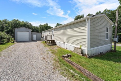 Welcome to your new home! This corner lot manufactured home in on Lake Tansi Village Country Club in Tennessee - for sale on GolfHomes.com, golf home, golf lot