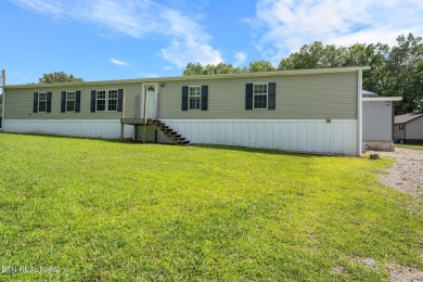 Welcome to your new home! This corner lot manufactured home in on Lake Tansi Village Country Club in Tennessee - for sale on GolfHomes.com, golf home, golf lot