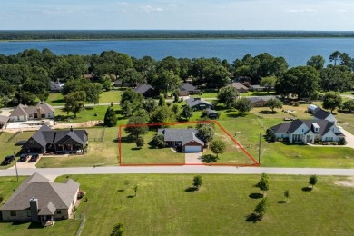 Located just a few blocks from a scenic 9-hole golf course, this on Star Harbor Golf Club in Texas - for sale on GolfHomes.com, golf home, golf lot