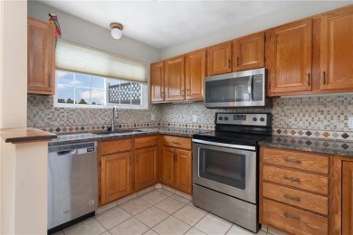 This fantastic, duplex-style townhome is located in the on Louisquisset Golf Club in Rhode Island - for sale on GolfHomes.com, golf home, golf lot