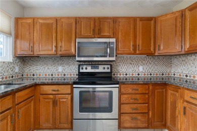 This fantastic, duplex-style townhome is located in the on Louisquisset Golf Club in Rhode Island - for sale on GolfHomes.com, golf home, golf lot