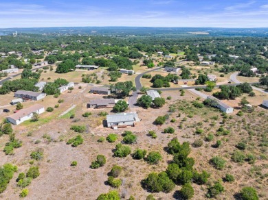 Embrace the serene Hill Country lifestyle with this exceptional on Slick Rock Golf Course - Horseshoe Bay in Texas - for sale on GolfHomes.com, golf home, golf lot