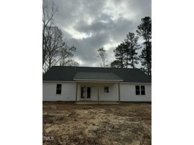 Don't miss this stunning new construction home right here on The on River Golf and County Club at Lake Royale in North Carolina - for sale on GolfHomes.com, golf home, golf lot