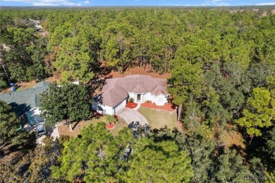 This spacious and inviting three-bedroom, plus den, two-bath on Sugarmill Woods Golf and Country Club in Florida - for sale on GolfHomes.com, golf home, golf lot