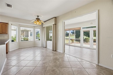 Serenity awaits in this inviting Madeira model, perfectly on Eagle Ridge At Spruce Creek Country Club in Florida - for sale on GolfHomes.com, golf home, golf lot