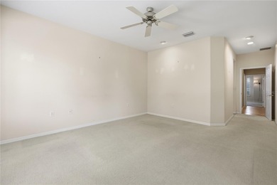 Serenity awaits in this inviting Madeira model, perfectly on Eagle Ridge At Spruce Creek Country Club in Florida - for sale on GolfHomes.com, golf home, golf lot