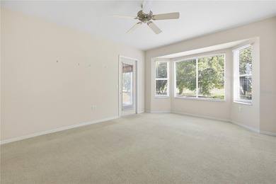 Serenity awaits in this inviting Madeira model, perfectly on Eagle Ridge At Spruce Creek Country Club in Florida - for sale on GolfHomes.com, golf home, golf lot