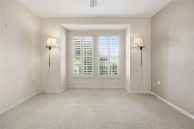 Serenity awaits in this inviting Madeira model, perfectly on Eagle Ridge At Spruce Creek Country Club in Florida - for sale on GolfHomes.com, golf home, golf lot