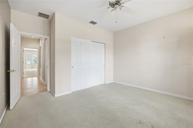 Serenity awaits in this inviting Madeira model, perfectly on Eagle Ridge At Spruce Creek Country Club in Florida - for sale on GolfHomes.com, golf home, golf lot