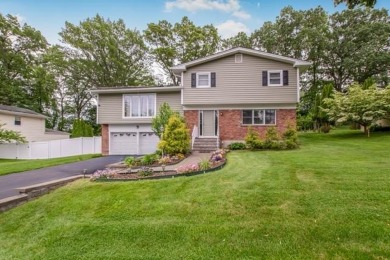 Meticulously maintained split-level home in Elmsford with major on Elmwood Country Club in New York - for sale on GolfHomes.com, golf home, golf lot