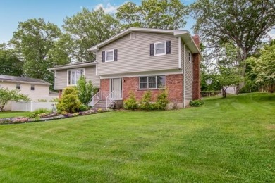Meticulously maintained split-level home in Elmsford with major on Elmwood Country Club in New York - for sale on GolfHomes.com, golf home, golf lot