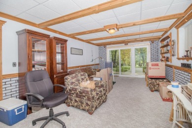 Welcome to this charming ranch-style home overlooking the 4th on Canadian Lakes Country Club-The Highlands Course in Michigan - for sale on GolfHomes.com, golf home, golf lot