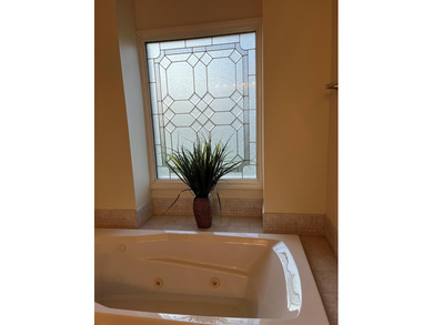 A lovely French inspired home overlooking the new Olde Eight on The Links At Stoney Point in South Carolina - for sale on GolfHomes.com, golf home, golf lot