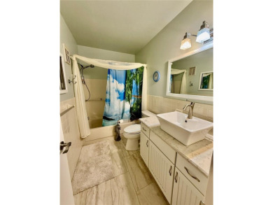 This GROUND FLOOR condo is a true gem with 1,400 sq ft of living on On Top Of The World Golf Course in Florida - for sale on GolfHomes.com, golf home, golf lot