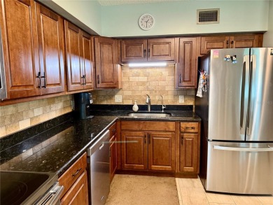This GROUND FLOOR condo is a true gem with 1,400 sq ft of living on On Top Of The World Golf Course in Florida - for sale on GolfHomes.com, golf home, golf lot