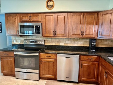This GROUND FLOOR condo is a true gem with 1,400 sq ft of living on On Top Of The World Golf Course in Florida - for sale on GolfHomes.com, golf home, golf lot