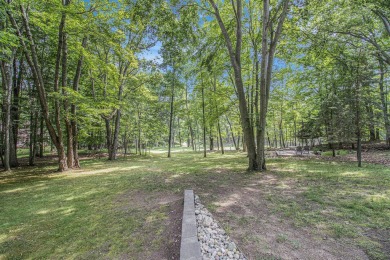 Welcome to this charming ranch-style home overlooking the 4th on Canadian Lakes Country Club-The Highlands Course in Michigan - for sale on GolfHomes.com, golf home, golf lot