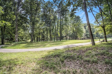 Welcome to this charming ranch-style home overlooking the 4th on Canadian Lakes Country Club-The Highlands Course in Michigan - for sale on GolfHomes.com, golf home, golf lot