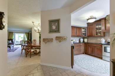 Elegant condominium with GARAGE in well established gated on Pointe Royale Village Country Club in Missouri - for sale on GolfHomes.com, golf home, golf lot