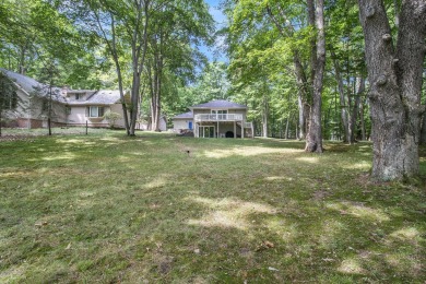 Welcome to this charming ranch-style home overlooking the 4th on Canadian Lakes Country Club-The Highlands Course in Michigan - for sale on GolfHomes.com, golf home, golf lot