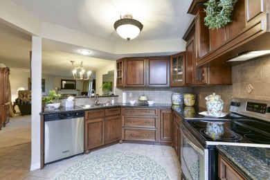 Elegant condominium with GARAGE in well established gated on Pointe Royale Village Country Club in Missouri - for sale on GolfHomes.com, golf home, golf lot