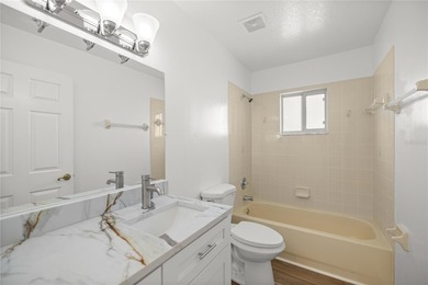 Welcome to this beautifully renovated three-bedroom on Royal Oaks Golf Club in Florida - for sale on GolfHomes.com, golf home, golf lot