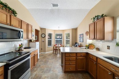 This beautifully maintained Whispering Pines model with NO BOND on Glenview Championship Golf and Country Club in Florida - for sale on GolfHomes.com, golf home, golf lot
