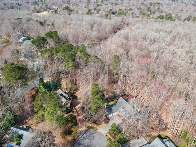 This serene wooded lot in Ford's Colony features a gentle slope on Fords Colony Country Club in Virginia - for sale on GolfHomes.com, golf home, golf lot