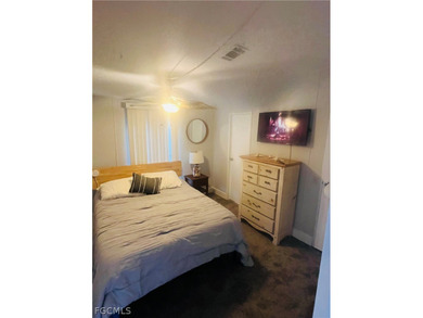 Turnkey Naples Living in a Vibrant 55+ Community! This on Riviera Golf Club in Florida - for sale on GolfHomes.com, golf home, golf lot