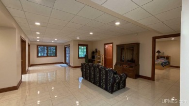 This executive home features 6750 sq. ft. Conveniently located on Marquette Golf Club in Michigan - for sale on GolfHomes.com, golf home, golf lot