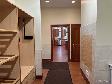 This executive home features 6528 sq. ft. of luxurious space on Marquette Golf Club in Michigan - for sale on GolfHomes.com, golf home, golf lot