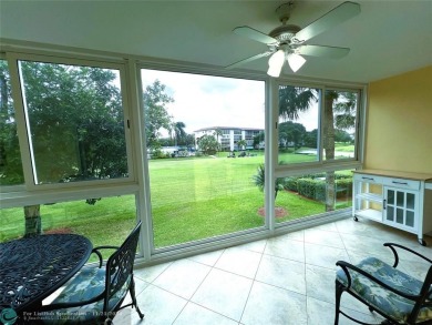 BACK ON MARKET 2nd FLOOR CORNER with WIDE GOLF/LAKE/POOL VIEW on Wynmoor Golf Course in Florida - for sale on GolfHomes.com, golf home, golf lot
