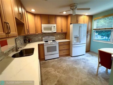 BACK ON MARKET 2nd FLOOR CORNER with WIDE GOLF/LAKE/POOL VIEW on Wynmoor Golf Course in Florida - for sale on GolfHomes.com, golf home, golf lot