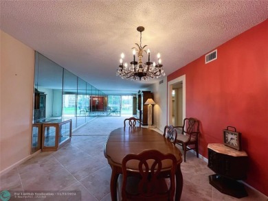 BACK ON MARKET 2nd FLOOR CORNER with WIDE GOLF/LAKE/POOL VIEW on Wynmoor Golf Course in Florida - for sale on GolfHomes.com, golf home, golf lot