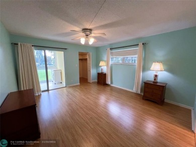 BACK ON MARKET 2nd FLOOR CORNER with WIDE GOLF/LAKE/POOL VIEW on Wynmoor Golf Course in Florida - for sale on GolfHomes.com, golf home, golf lot