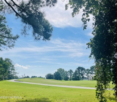 Welcome to coastal living at its finest in Crow Creek! This on Crow Creek Golf Club in North Carolina - for sale on GolfHomes.com, golf home, golf lot