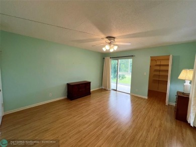 BACK ON MARKET 2nd FLOOR CORNER with WIDE GOLF/LAKE/POOL VIEW on Wynmoor Golf Course in Florida - for sale on GolfHomes.com, golf home, golf lot