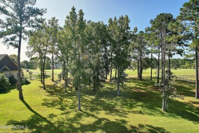 Welcome to coastal living at its finest in Crow Creek! This on Crow Creek Golf Club in North Carolina - for sale on GolfHomes.com, golf home, golf lot