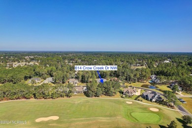 Welcome to coastal living at its finest in Crow Creek! This on Crow Creek Golf Club in North Carolina - for sale on GolfHomes.com, golf home, golf lot