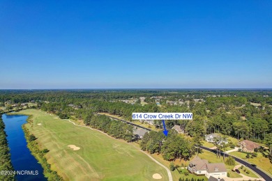 Welcome to coastal living at its finest in Crow Creek! This on Crow Creek Golf Club in North Carolina - for sale on GolfHomes.com, golf home, golf lot