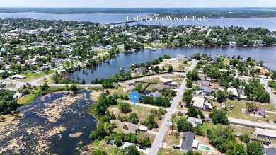WATERFRONT! Large lot located in the highly desired 'Lynn Haven' on Panama Country Club in Florida - for sale on GolfHomes.com, golf home, golf lot