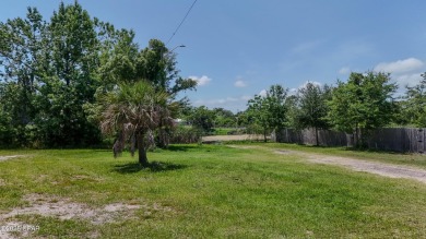 WATERFRONT! Large lot located in the highly desired 'Lynn Haven' on Panama Country Club in Florida - for sale on GolfHomes.com, golf home, golf lot