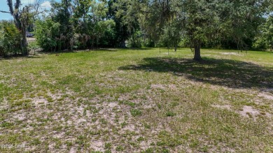 WATERFRONT! Large lot located in the highly desired 'Lynn Haven' on Panama Country Club in Florida - for sale on GolfHomes.com, golf home, golf lot