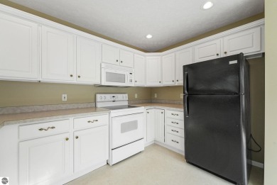 Enjoy low-maintenance living with beautiful golf course views in on Crown Golf Course in Michigan - for sale on GolfHomes.com, golf home, golf lot