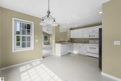 Enjoy low-maintenance living with beautiful golf course views in on Crown Golf Course in Michigan - for sale on GolfHomes.com, golf home, golf lot