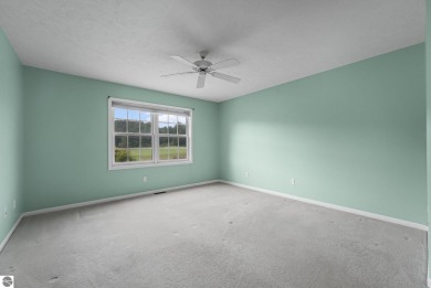 Enjoy low-maintenance living with beautiful golf course views in on Crown Golf Course in Michigan - for sale on GolfHomes.com, golf home, golf lot