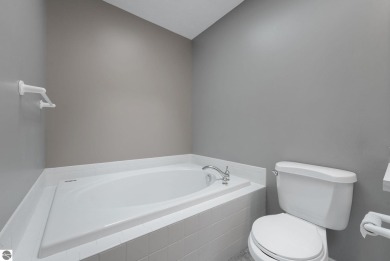 Enjoy low-maintenance living with beautiful golf course views in on Crown Golf Course in Michigan - for sale on GolfHomes.com, golf home, golf lot