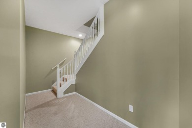 Enjoy low-maintenance living with beautiful golf course views in on Crown Golf Course in Michigan - for sale on GolfHomes.com, golf home, golf lot